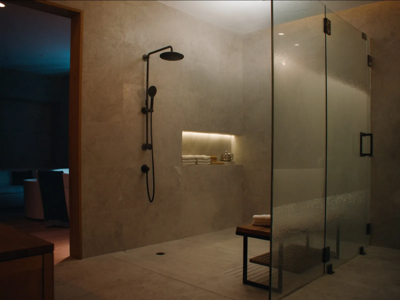 Luxury walk-in shower with frameless glass and matte black fixtures