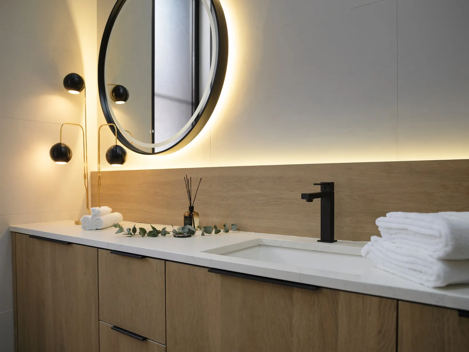 Custom oak vanity with quartz waterfall counter